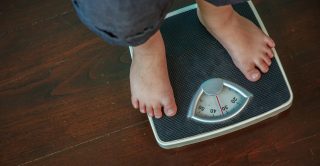 Child stands on scales