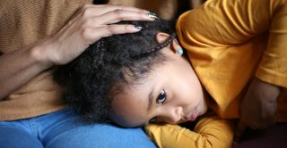 Importance of early intervention - unhappy girl sits with mother